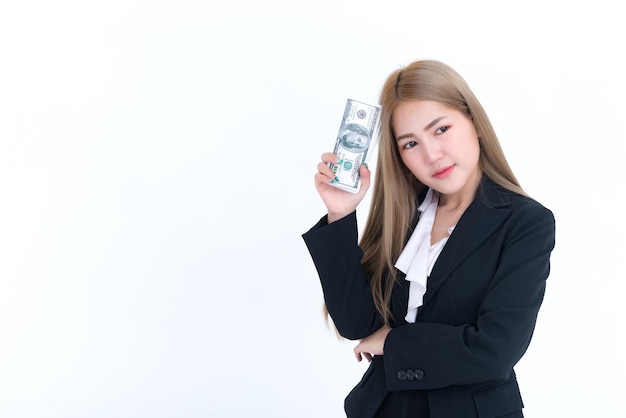 Beautiful asian woman with dollar money in hand on white\
backgroundworker has a lot of moneyday of paythe salary of the\
employeesthailand people