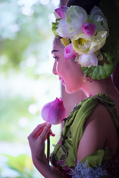 Beautiful Asian woman with lotus flower