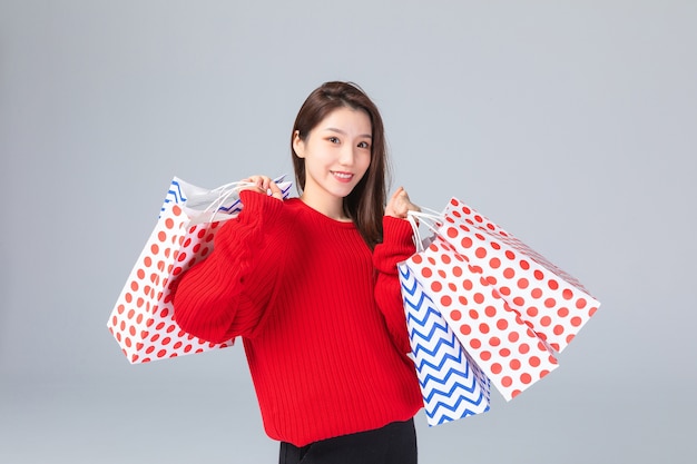 Beautiful Asian woman with shopping bags