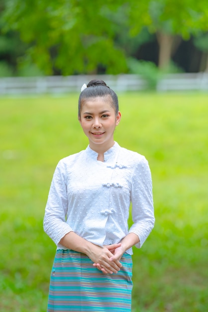 Beautiful asian young woman of north thailand traditional dress, identity culture of Thailand.