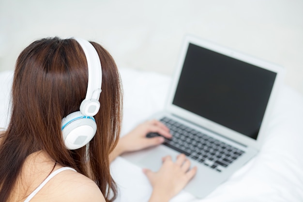 Beautiful asian young woman relax listening to music