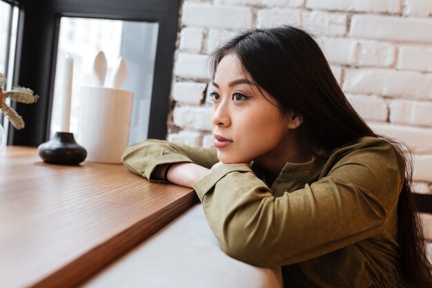 Beautiful asian young woman sitting at the cafe.