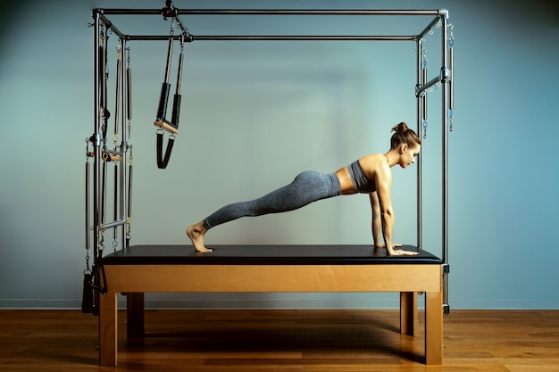 Beautiful athletic woman doing exercises