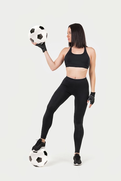 Beautiful athletic woman with the ball