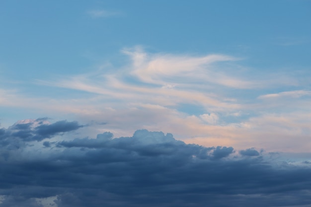 Beautiful atmospheric dramatic clouds in the evening at sunset.