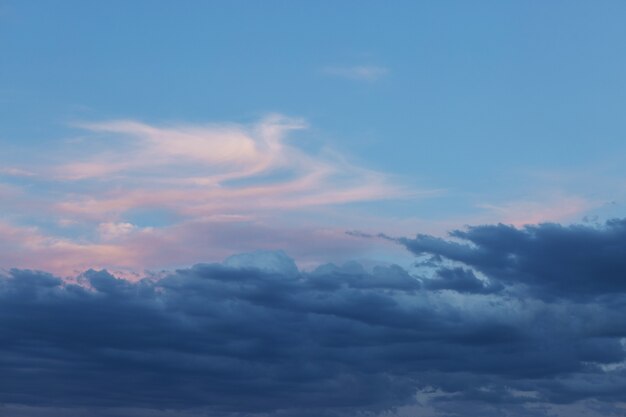 Beautiful atmospheric dramatic clouds in the evening at sunset.