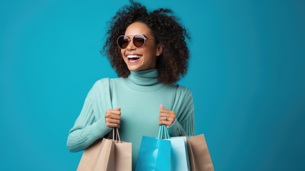 Beautiful attractive smiling woman holding shopping bags posing on blue background