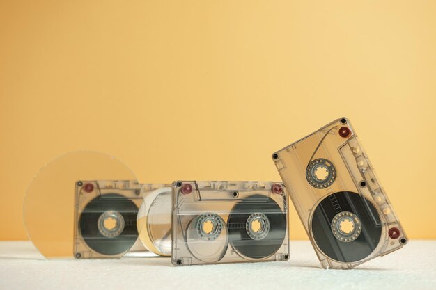 Beautiful Audio cassettes tape on a white table and yellow spaceMinimalism retro style concept 80s