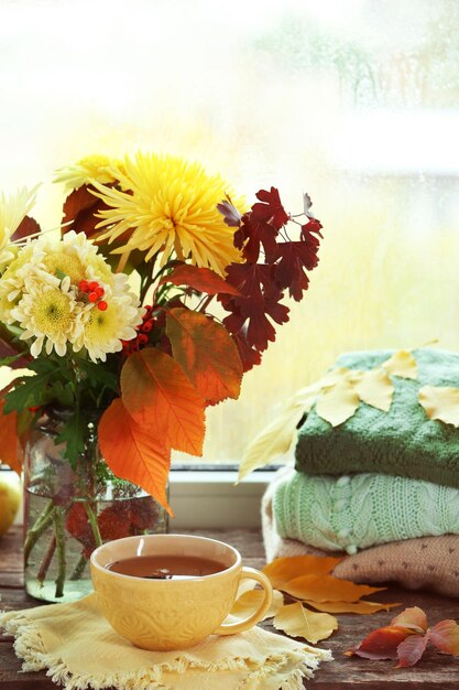 Beautiful autumn bouquet with chrysanthemums flowers on windowsill