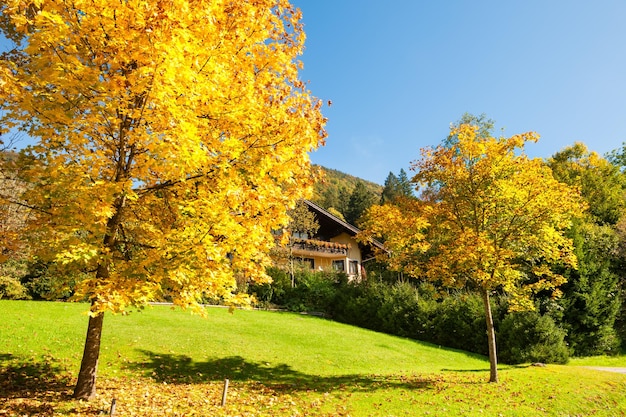 Beautiful autumn landscape in Austrian Alps. Countryhouse in the mountains