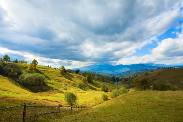 Beautiful autumn mountain and small village on mountainside (Carpathian. Ukraine)