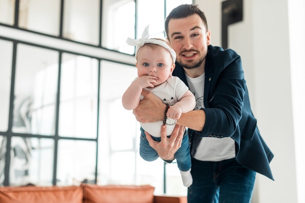 Beautiful baby girl and her young father