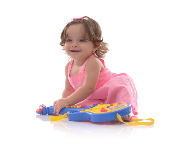 Beautiful Baby Girl With Toy Guitar