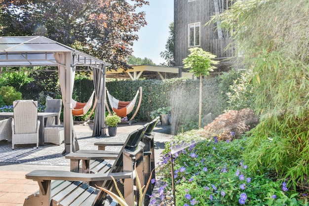 Beautiful backyard terrace full of furniture and decorative plants