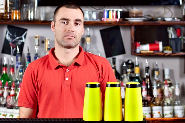 Beautiful barmen in red polo