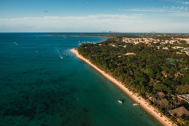 On the beautiful beach of the island of Mauritius along the coast.