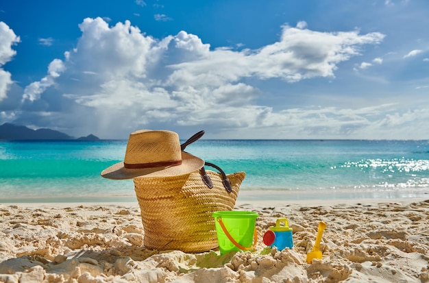 Beautiful beach with bag and toys at Seychelles