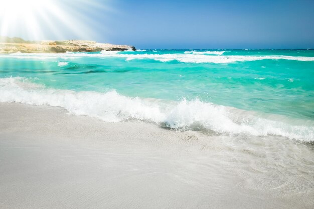 Beautiful beach with waves in the nature of the background