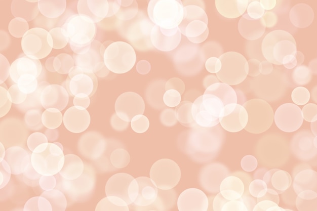 Beautiful beige background with many blurry white lights similar to bokeh.