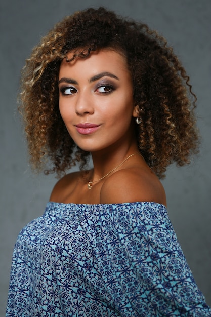 Beautiful black woman portrait with curly hair