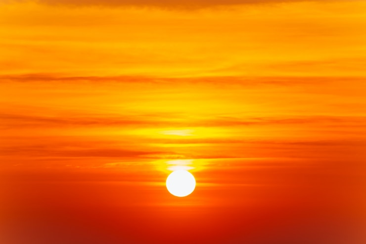 Beautiful blazing sunset landscape and orange sky above it.