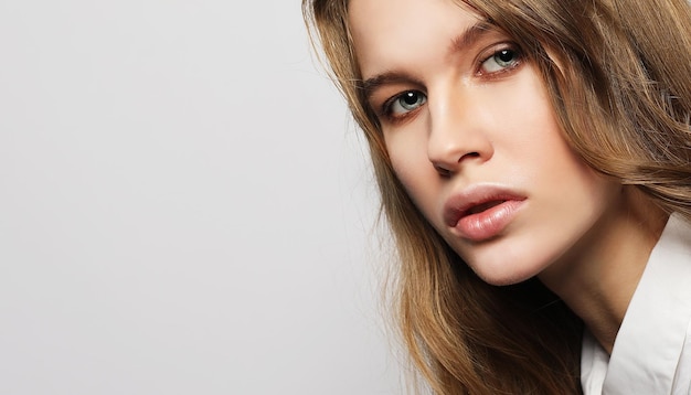 Beautiful blond girl over white background