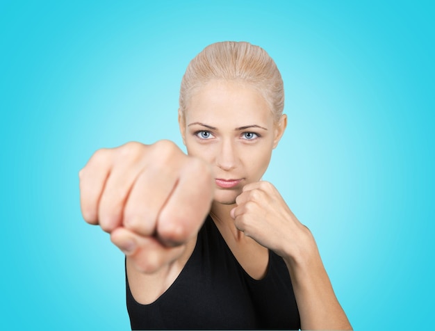 Photo beautiful blond woman boxing  isolated on white