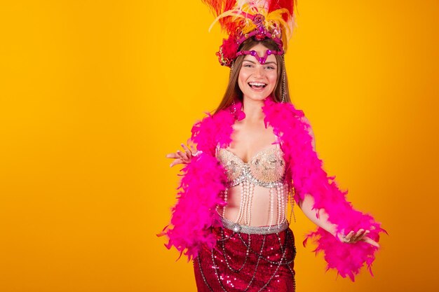 Beautiful blonde brazilian woman with queen clothes from samba school carnival Feather crown well