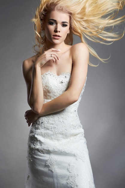 Beautiful blonde bride woman in wedding dress
