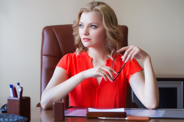 Beautiful blonde businesswoman in office