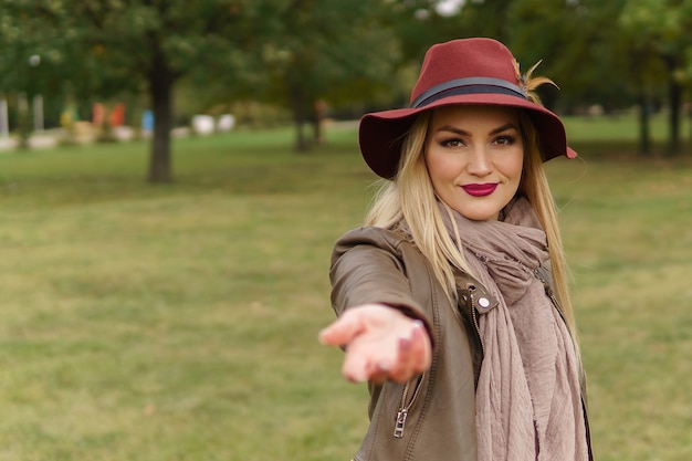 Beautiful blonde girl walking in the park