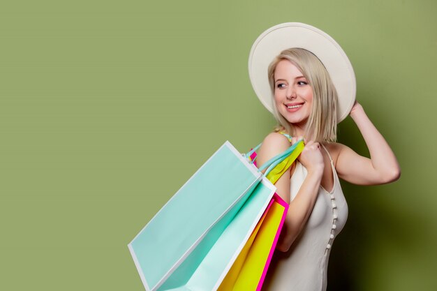 Beautiful blonde girl with shopping bags