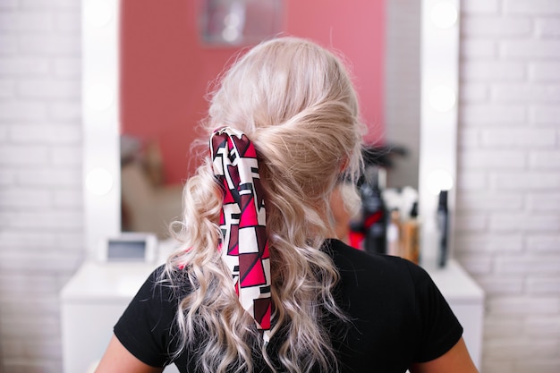 Beautiful blonde hair girl with fashion hair band clips