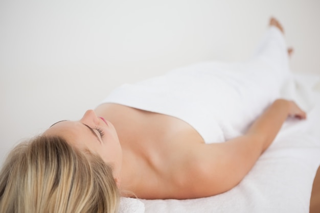 Beautiful blonde lying on massage table 