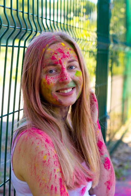 Beautiful blonde model covered color powder Holi