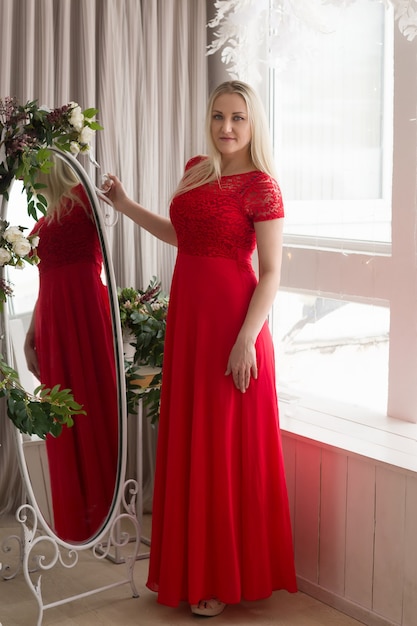 Beautiful blonde in a red dress