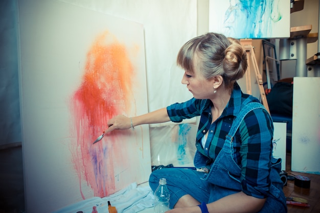 beautiful blonde woman painter