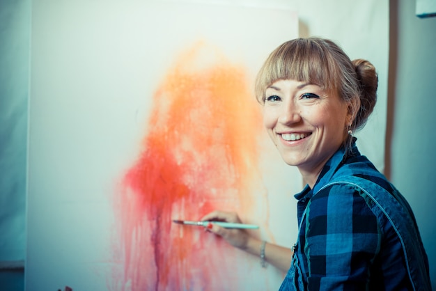 beautiful blonde woman painter