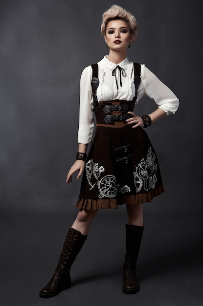 Beautiful blonde woman in steampunk style costume