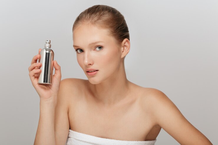 Beautiful blonde woman with perfect skin and a perfume