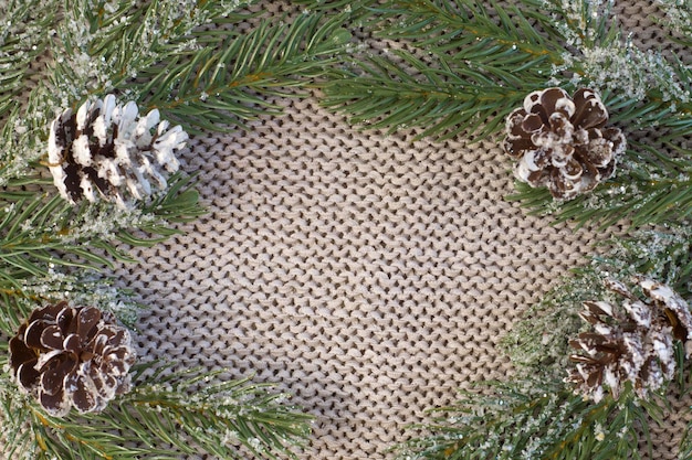 Beautiful blue Christmas garland with copy space on cozy light textured close up Selective focus