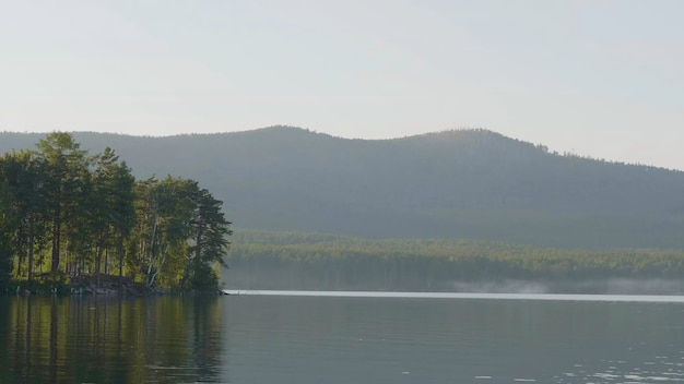 Beautiful blue clear water on the shore of the lake view of the lake of the woods