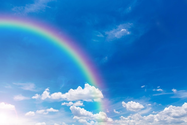 beautiful blue sky with rainbow and clouds.