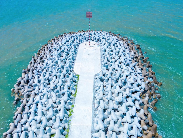 Beautiful blue skyline panoramic in Loc An Canal Scenery landscape of fishing port with tsunami protection concrete blocks Cityscape and boats in the sea Loc An village near Vung Tau City