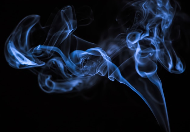 Beautiful blue smoke on a black background