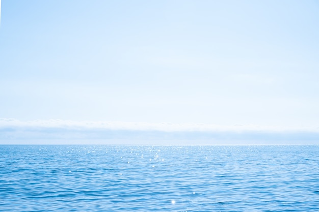 Beautiful blue sparkling Black sea,sky, horizon and clouds in sunny weather. Russian coast.