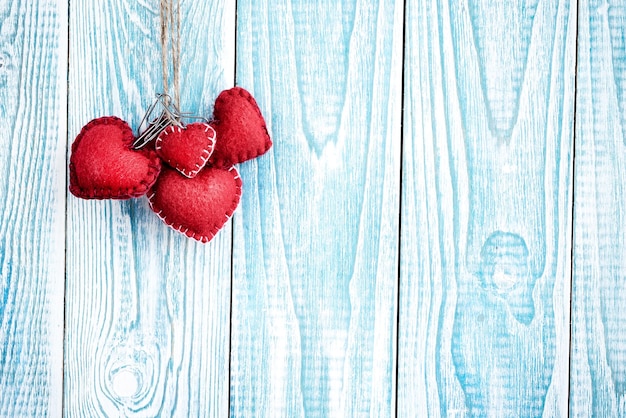 Beautiful blue wooden background with red hearts Best card for Valentines day