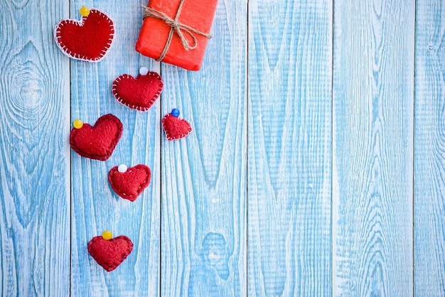 Beautiful blue wooden background with red hearts Best card for Valentines day