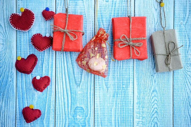 Beautiful blue wooden background with red hearts Best card for Valentines day