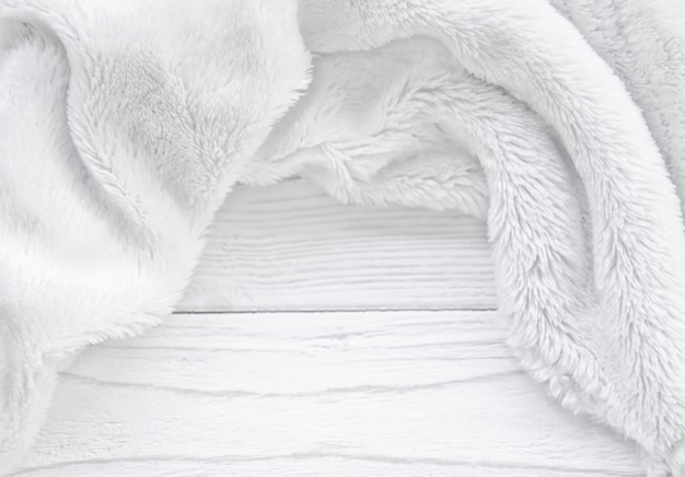 Beautiful blurred white fur on a worn wooden background